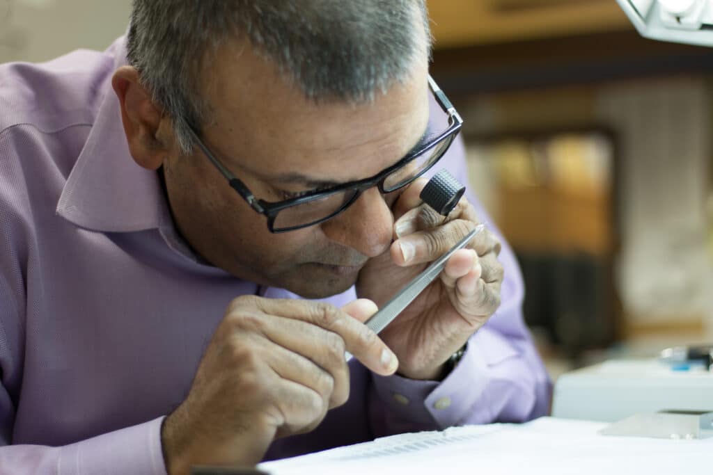 Nicky Mehta, RS, Chief Marketing Officer at Diamond Days, picking diamonds.